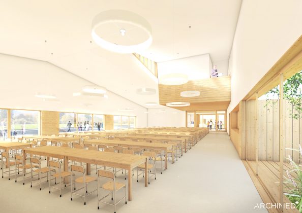 Ilustracja. Nowa szkoła i biblioteka w Julianowie - szkic. Zdjęcie przedstawia duże pomieszczenie z przeznaczeniem na stołówkę szkolną wyposażoną w stoły i krzesła.